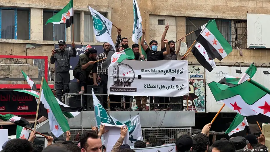 Protesters waving flags and banners