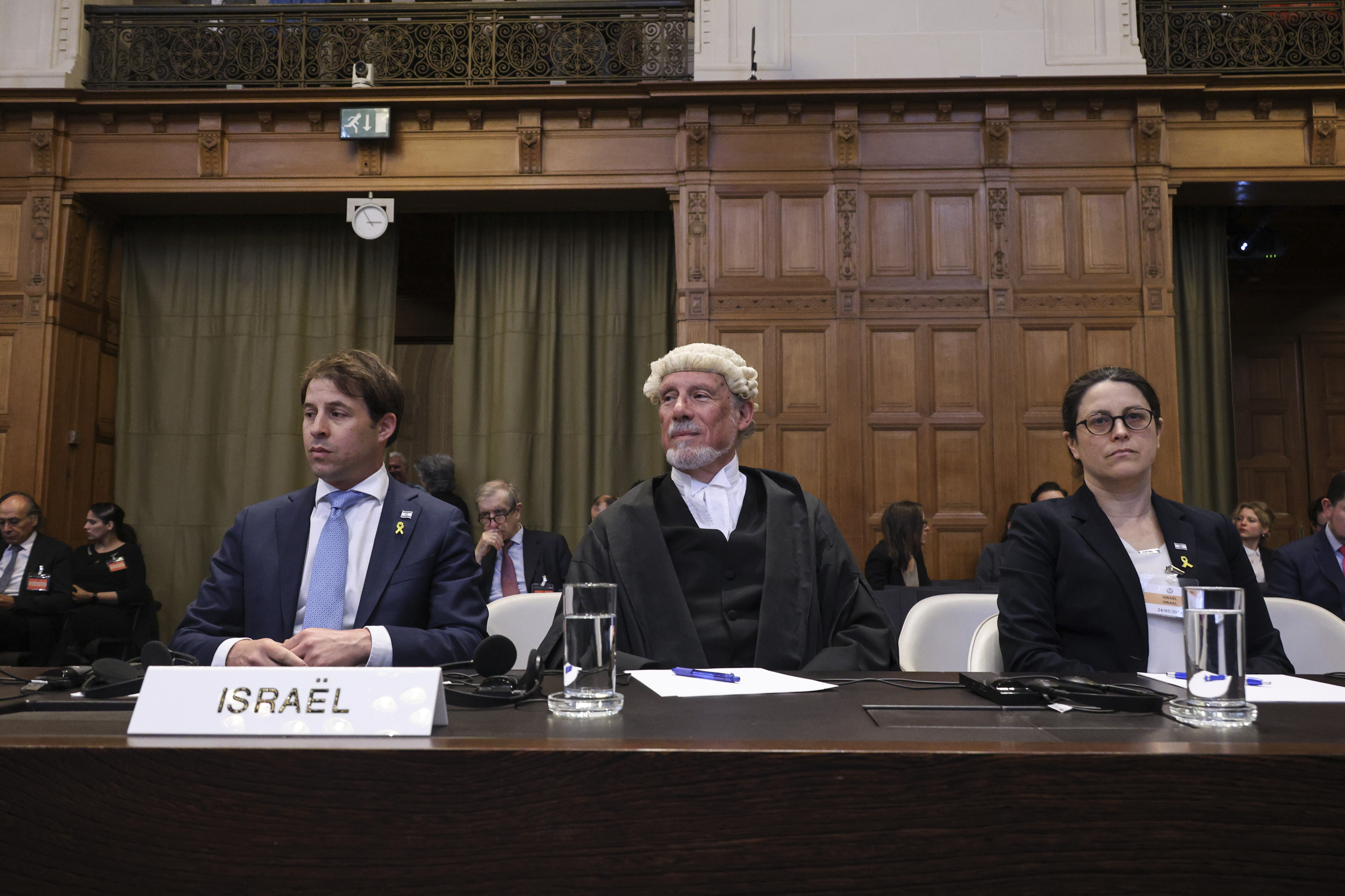 Members of the Israeli delegation sit in the courtroom of the International Court of Justice.