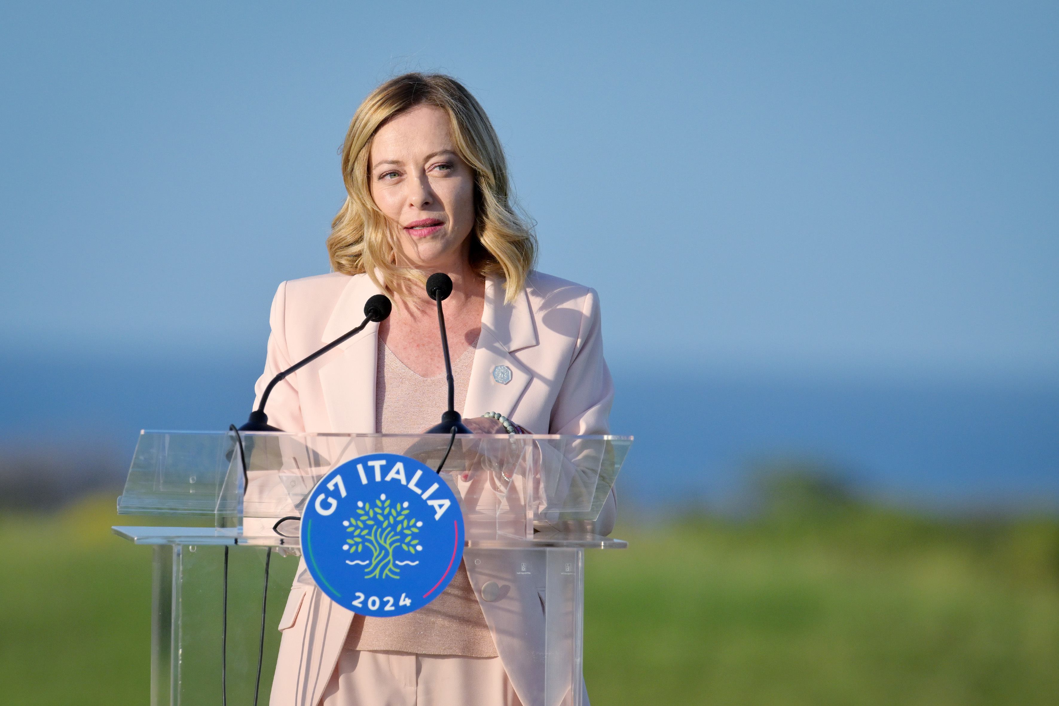 Italian Prime Minister Giorgia Meloni at the lectern during the G7 summit in Italy