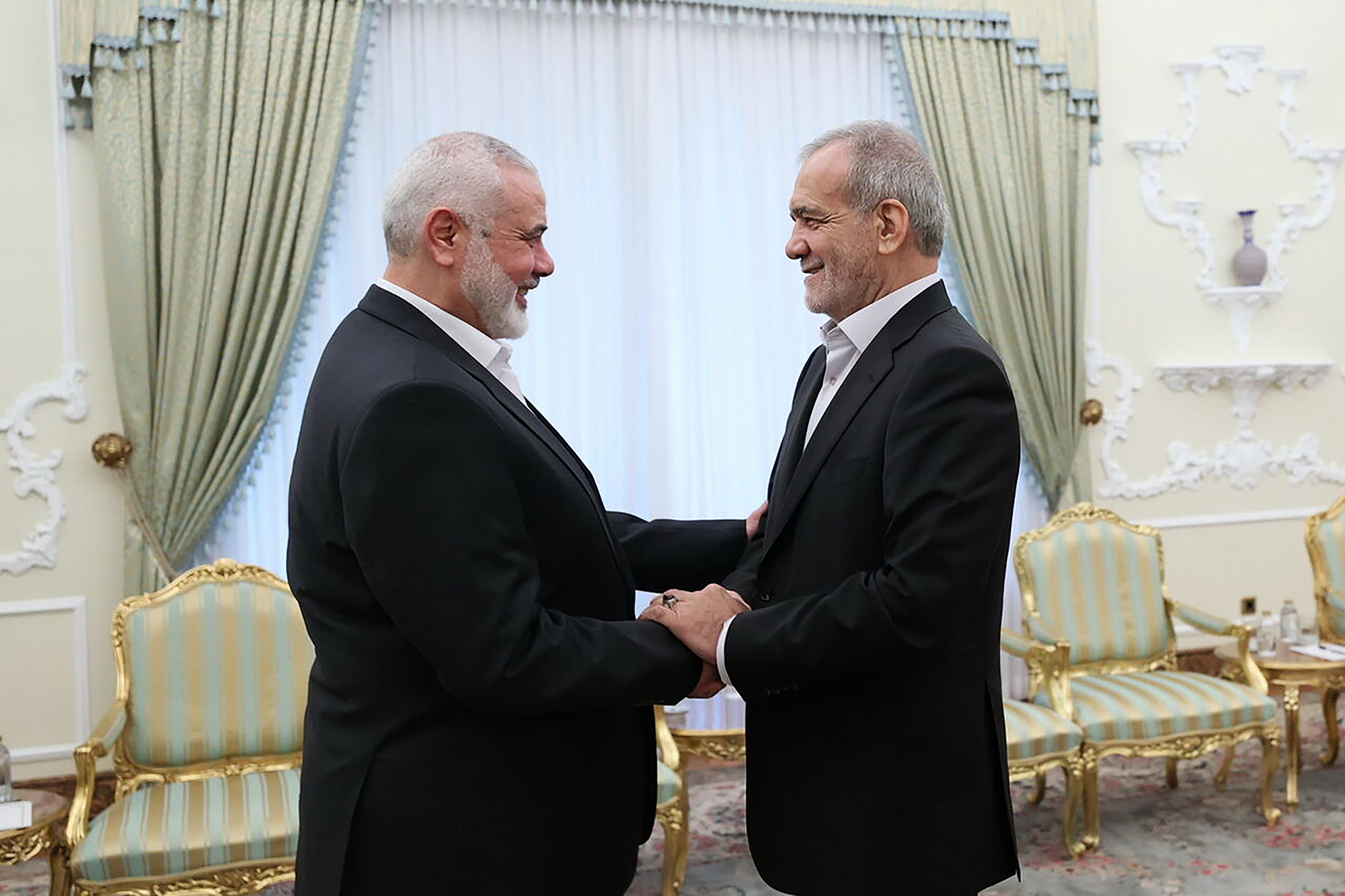 Ismail Haniyah (left), the political leader of Hamas, at a meeting with Iranian President Masoud Pezeshkian on 30 July 2024. 