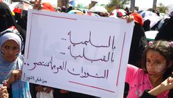 Children holding a placard that reads 