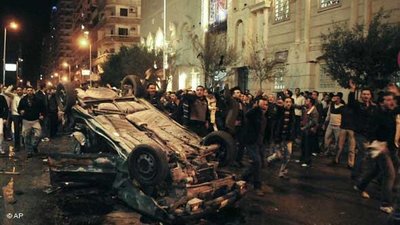 People on the streets after the bomb attack on a Coptic church in Alexandria (photo: AP)