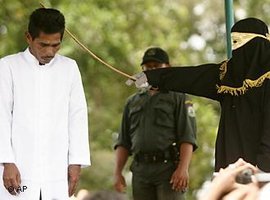 A man being publicly whipped in Jantho (photo: AP Photo/Heri Juanda)