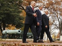 President Bush, center, walks with Israeli Prime Minister Ehud Olmert, left, and Palestinian President Mahmoud Abbas