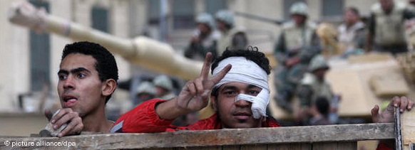 Joy and relief on Tahrir Square following the resignation of Mubarak. The pain and anguish appears to have been forgotten for now