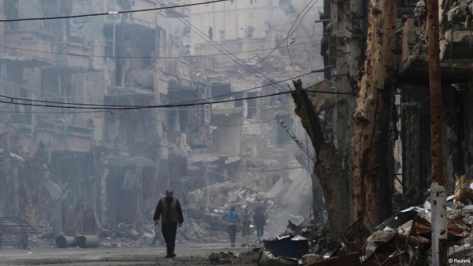 A man walks down a ruined street in Deir al-Zor (photo: Reuters)