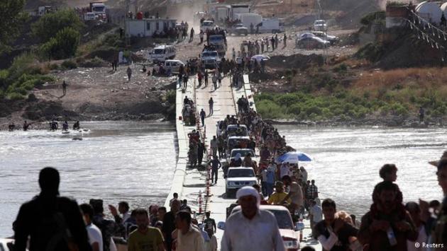 Yazidi refugees returning to Iraq from Syria (photo: Reuters)