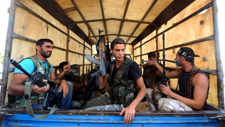 FSA fighters in the Salaheddin quarter of Aleppo (photo: picture-alliance/abaca)