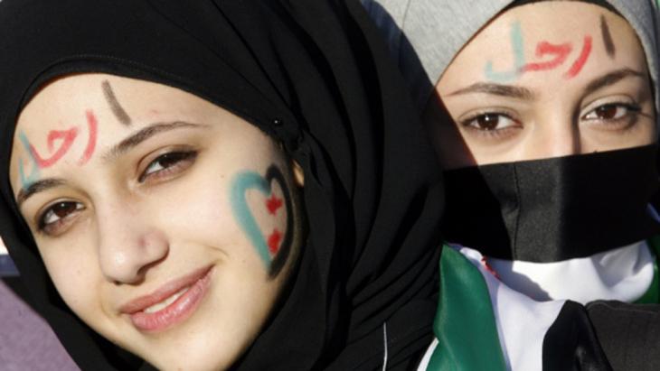 Young woman taking part in a demonstration against the Assad regime in Aleppo on 6 October 2012 (photo: Rawan Issa)