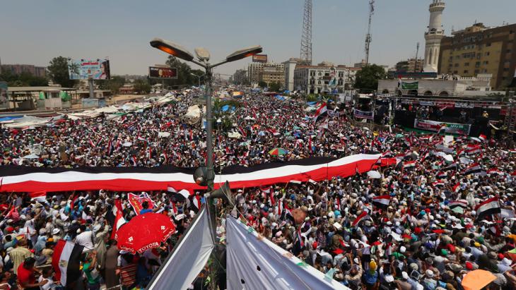 Pro-Morsi supporters during their week-long sit-in at a crossroads in front of the Rabaa al-Adawiya Mosque in Cairo (photo: Marwan Naamani/AFP/Getty Images)