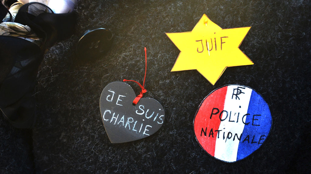 A woman wearing stickers at a unity rally in Strasbourg on 11 January 2015 (photo: AFP/Getty Images/P. Hertzog)