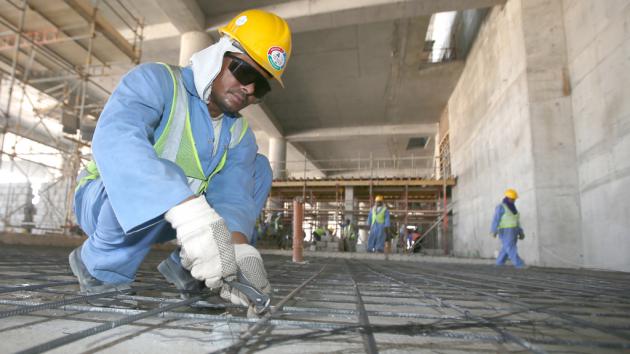 Workers on a construction site in Doha, Qatar (photo: Karim Jaafar/AFP/Getty Images)