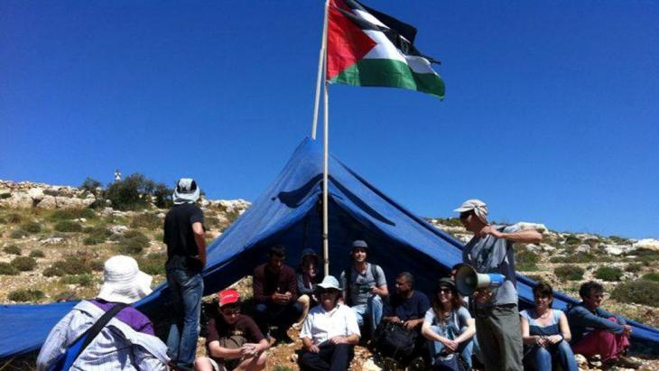 Activists from the Combatants for Peace group protesting against the expansion of an Israeli settlement (photo: Itmar Feigenbaum)