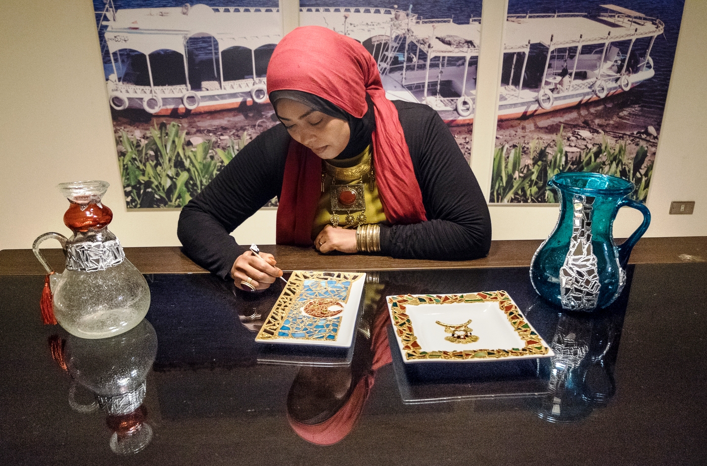 Nubian artist Saly Sayed works on contemporary decorative and art pieces inspired by Nubian and Islamic heritage (photo: Maya Hautefeuille)