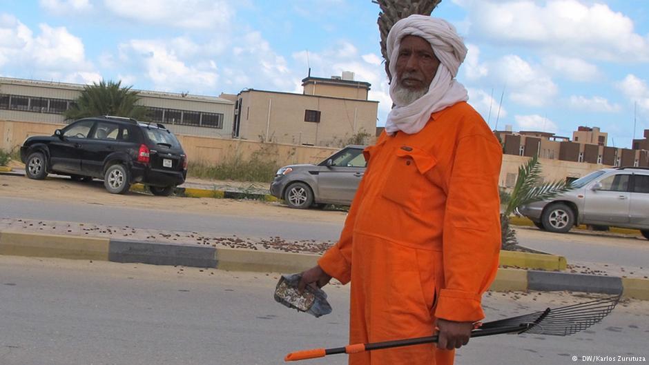 Issa, a Touareg tribesman, in an orange jumpsuit