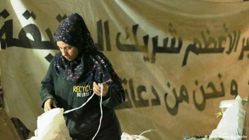 A Syrian refugee employed by Recycle Beirut sorts rubbish (photo: Natalie Mauthofer)