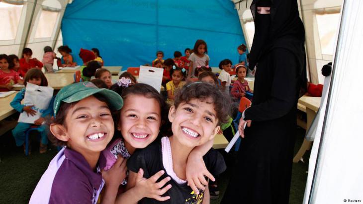 Syrian refugee children attend school in a UN tent in the Zaatari refugee camp, Jordan (photo: Reuters)