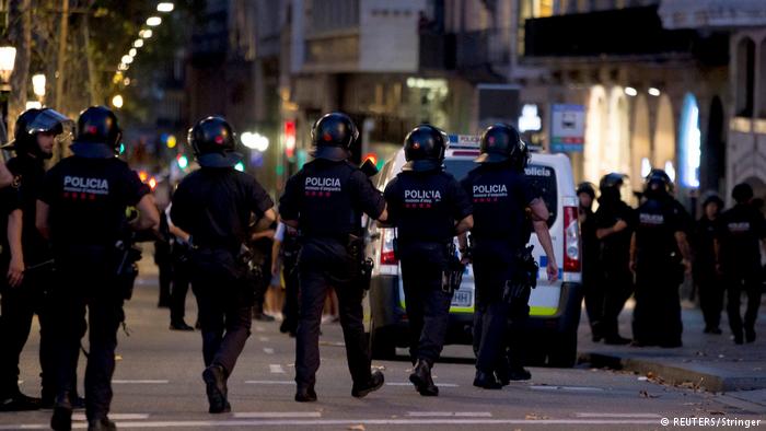 Spanish police officers walking down the road