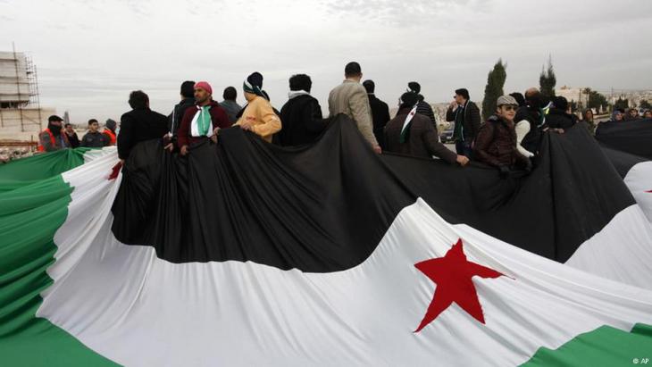 Secular Assad opponents demonstrate in front of the Syrian embassy in Amman in 2012 (photo: AP)