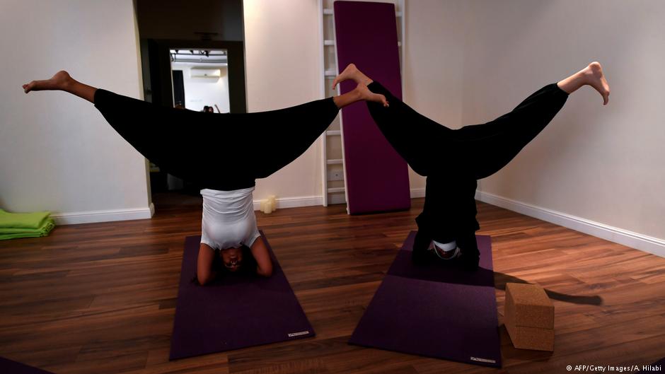 : Nouf Marwaai, 38, the head of the Arab Yoga Foundation (foreground), instructs her yoga students with at her studio in the western Saudi Arabian city of Jeddah on 7 September 2018 (photo: AFP/Getty Images/A. Hilabi)