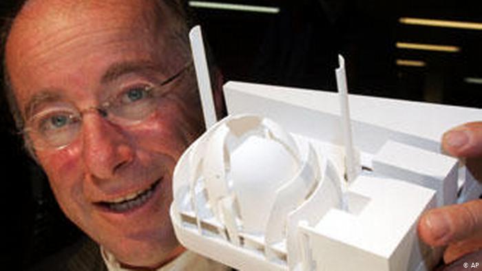 Paul Bohm holds up a model of the mosque (photo: AP)