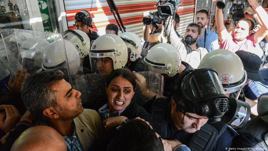 Turkish anti-riot police officers push back protesters and People's democracy Party (HDP) PM Feleknas Uca (centre) with their shields on 26 October 2016, during a demonstration against the detention of the Kurdish-majority city's co-mayors Gultan Kisanak and Firat Anli in Diyarbakir (photo: Getty Images/AFP/I. Akengin)