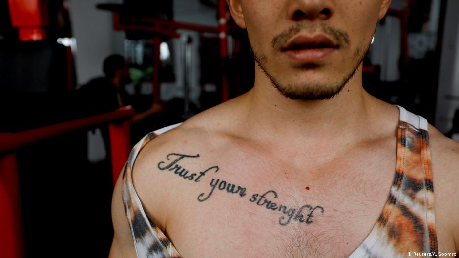 Naveed Ali Hazara, 23, poses for a photograph at a gym in Hazara Town, Quetta (photo: Reuters/A. Soomro)