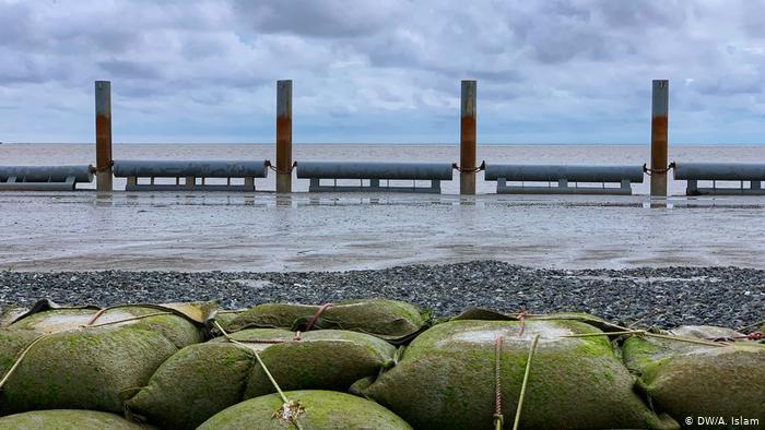 Protection from erosion: the silt island is called a "floating island" due to its unstable nature. Satellite images detected the island in 2002. Bangladeshi authorities have built a structure with pylons, gravel and sandbags to stop the island from being eroded