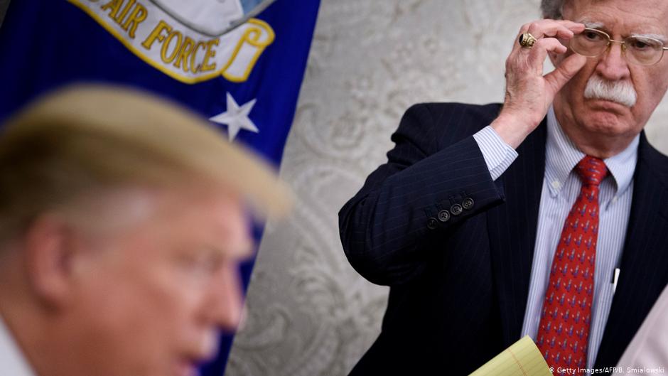 Former National Security advisor John Bolton as Donald Trump addresses a press conference in the Oval Office in 2019 (photo: Getty Images/AFP/B. Smialowski)