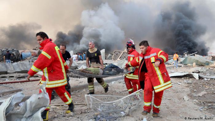 Man being evacuated following the explosion in Beirut (photo: Reuters/M. Azakir)