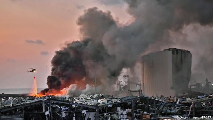 Helicopter douses fire following explosion in Beirut (photo: Getty Images/AFP/STR)