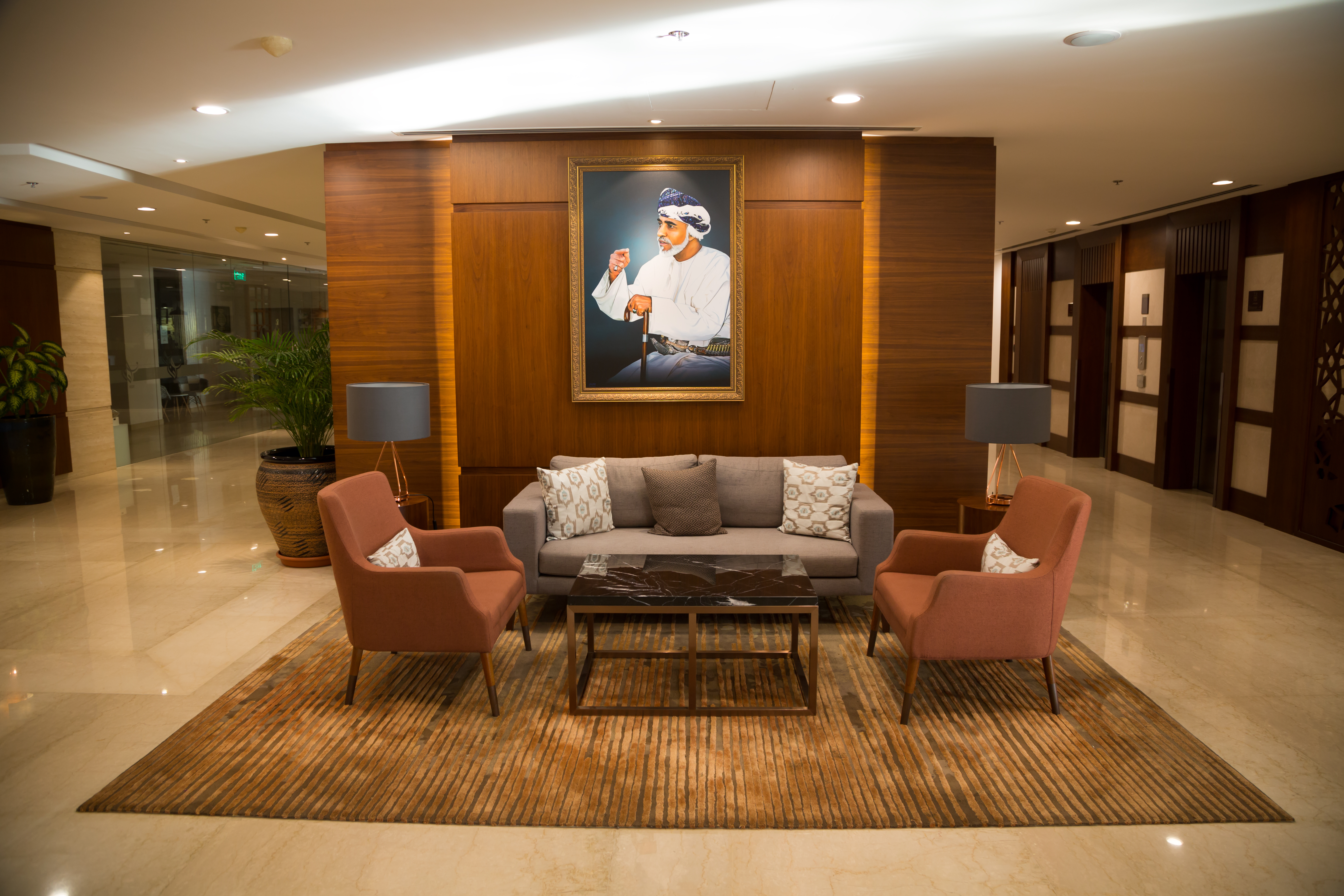 A portrait of Sultan Qaboos hangs in the lobby of the Fraser Suit Hotel in Muscat, in November 2019 (photo: Pascal Mannaerts)