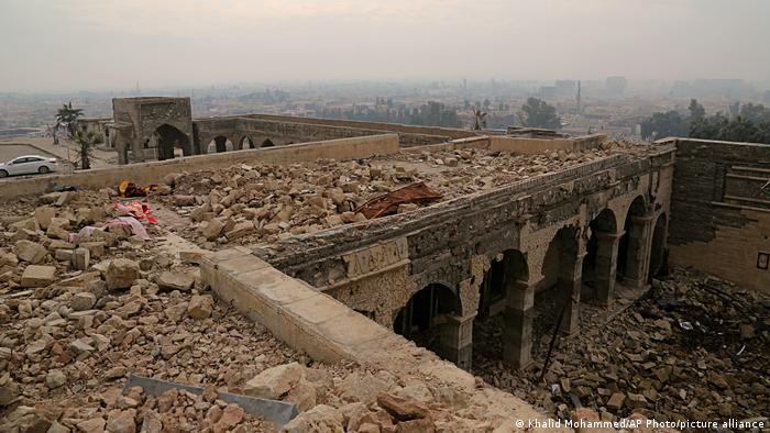 Ruin of Jonah shrine after destruction by IS, rubble on a stone structure