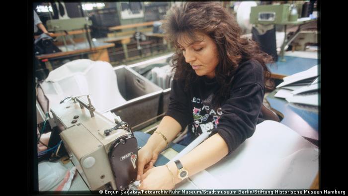 Woman upholstering a carseat