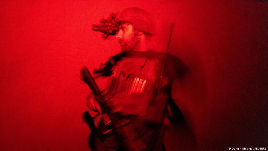 A member of the Afghan Special Forces keeps a watch as others search a house during a combat mission against Taliban, in Kandahar province, Afghanistan, 12 July 2021 (photo: REUTERS/Danish Siddiqui)