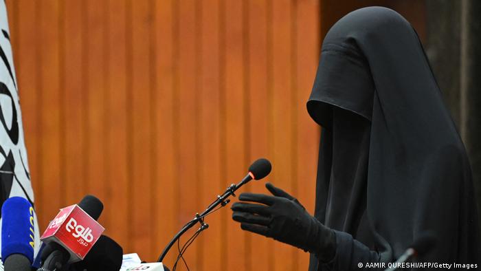 A female student in a full body shroud speaks at a pro-Taliban rally at the Shaheed Rabbani Education University in Kabul on 11 September 2021