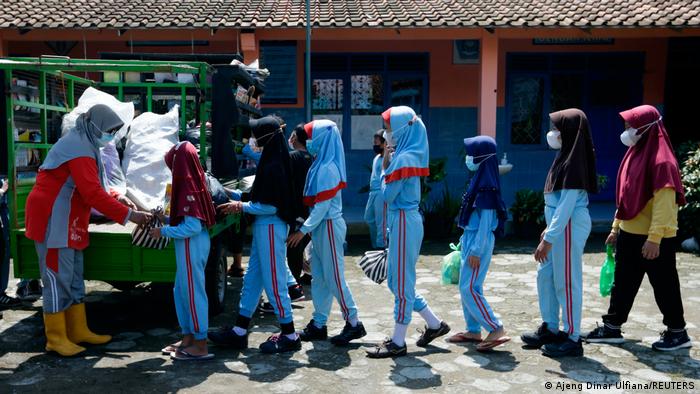 Children stand in line to borrow books