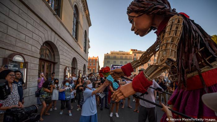 Little Amal receives floral tributes in Rome (photo: Antonio Masiello/Getty Images)