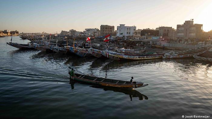 A small boat in a harbour full of fishing boats in Senegal