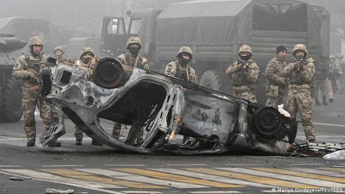 Armed paratroopers stand guard in Almaty