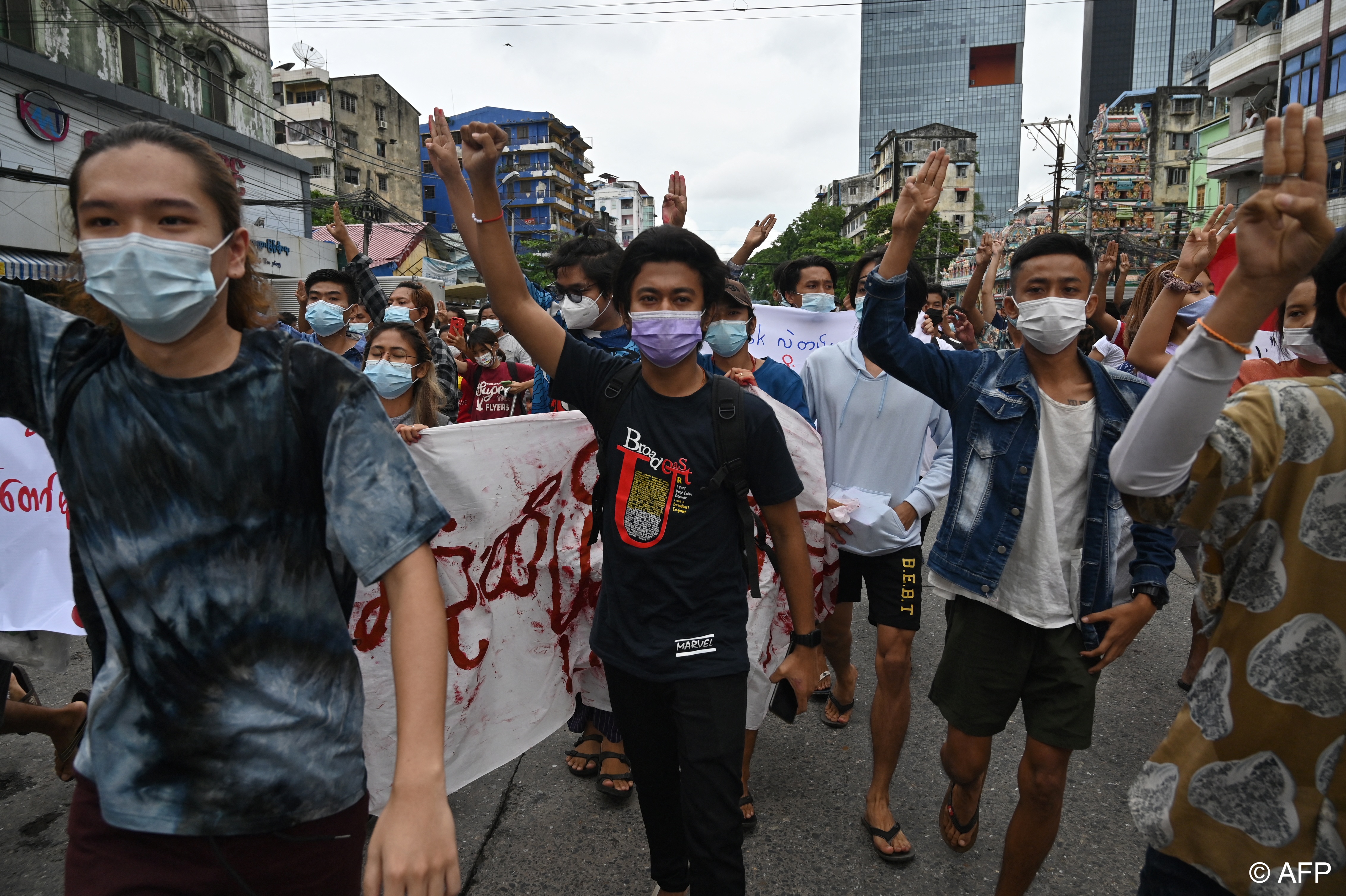 Images of young people in Myanmar flashing a three-finger salute spread quickly on Facebook (photo: STR AFP/File) 