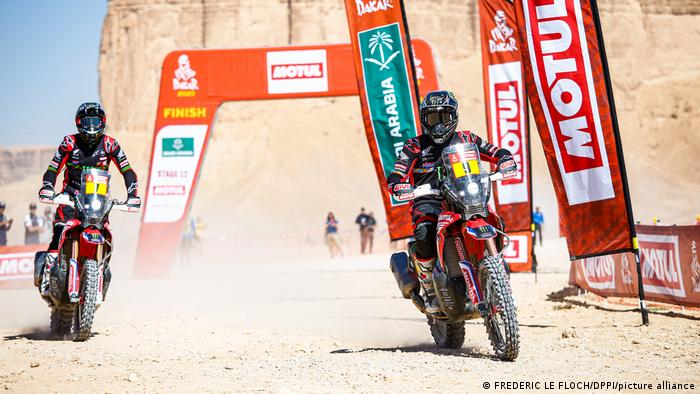 Two motorbikes cross the finish line at the 2020 Dakar Rally