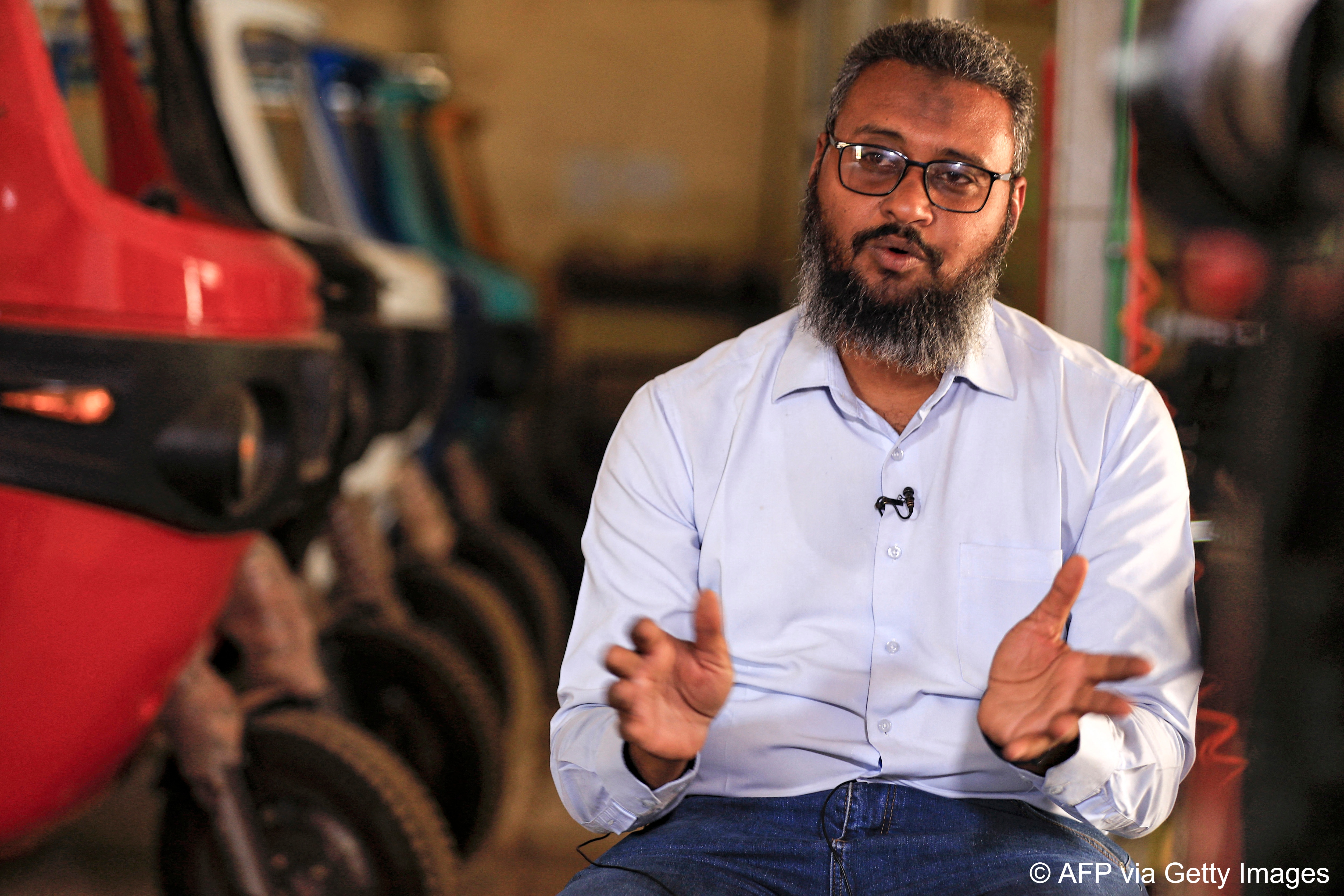 Mohamed Samir says the new electric vehicles check three boxes of the UN's sustainable development goals (photo: Ashraf Shazly/AFP)