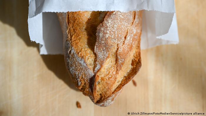 French baguette sticking out of a paper bag