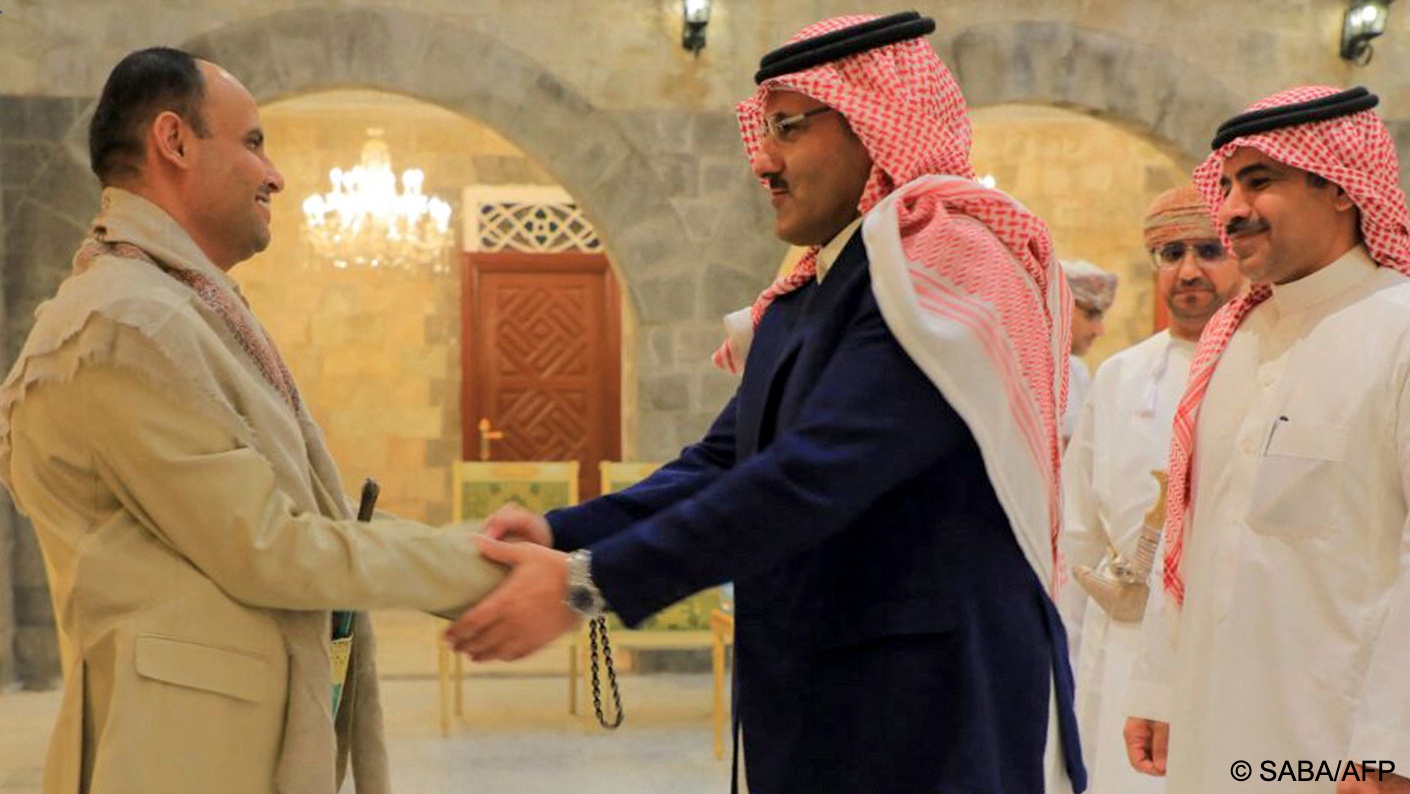 Houthi political leader, Mahdi al-Mashat, shakes hands with Saudi ambassador to Yemen, Mohammed Al-Jaber in Sanaa: Saudi Arabia and Iran's reconciliation represents a major geopolitical shift in the Middle East.