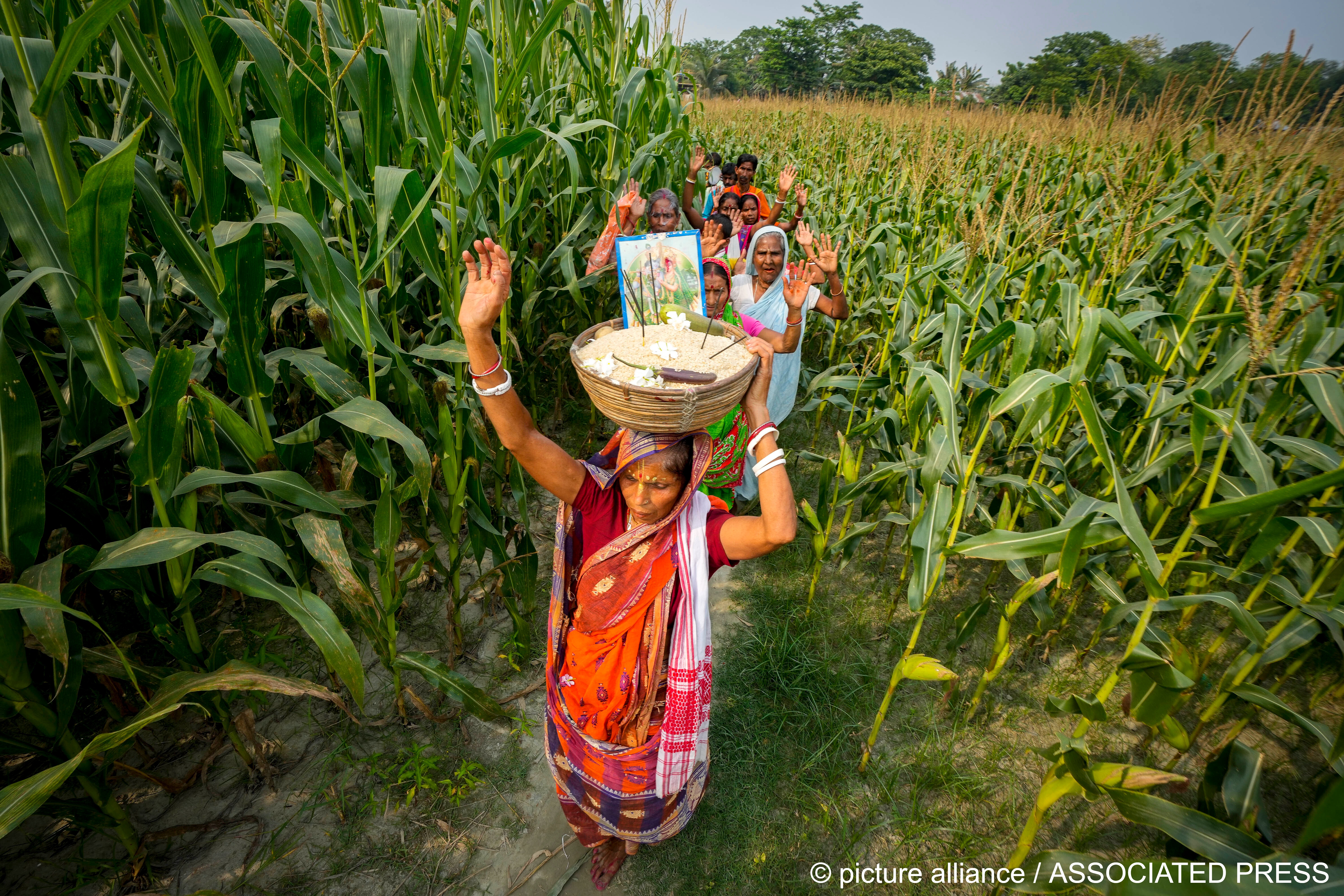 Hindu villagers celebrating Bengali New Year perform a ritual in Murkata village, north eastern Assam state, India, 15 April 2023 (image: AP PHoto/Anupam Nath)