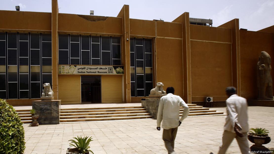 Two men walk towards the entrance to the Sudan National Museum in Khartoum (photo: Ashraf Shazly/AFP)