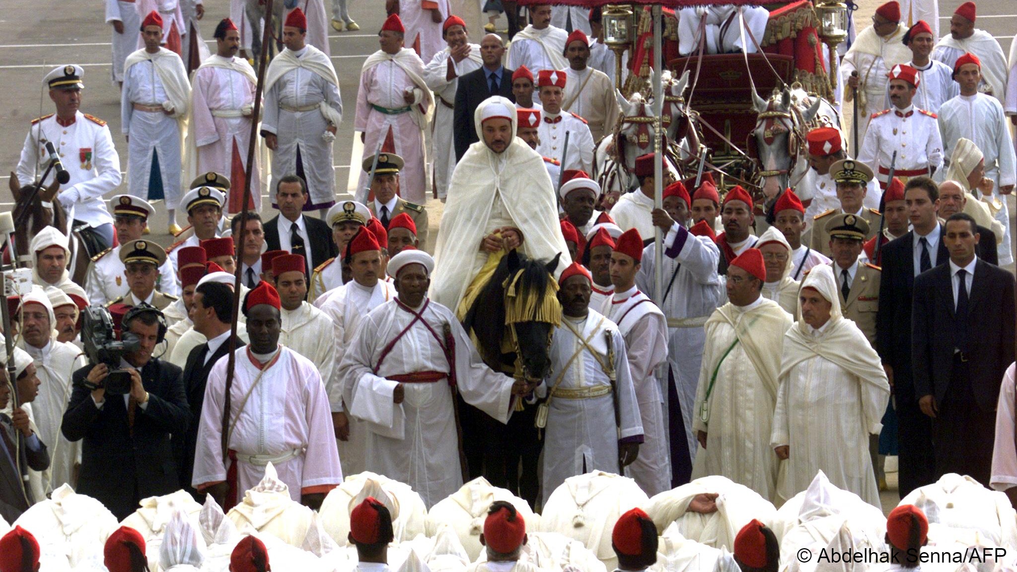 Mohammed VI of Morocco takes part in a formal parade (image: ABDELHAK SENNA / AFP)