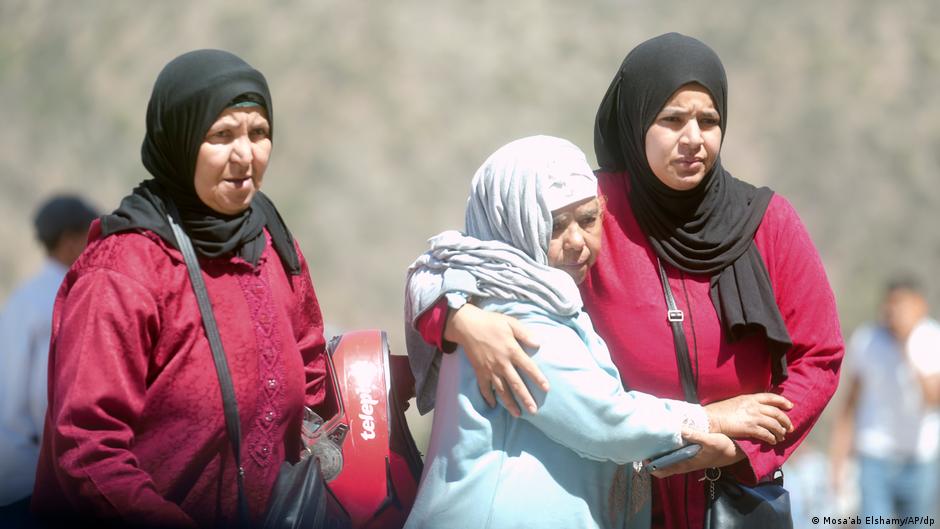 Women console each other on the streets of Marrakesh