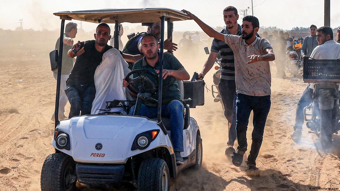 Palestinians with a suspected Israeli hostage (image: AFP/Getty Image) 